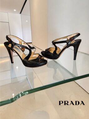 AUTHENTIC PRADA BLACK LEATHER TORTOISE BUCKLE STRAPY 4” HEEL. ELEGANT-SEXY